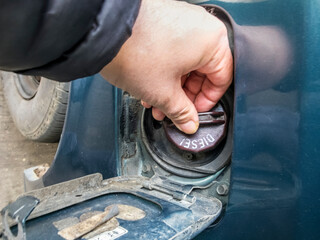 Replacing a diesel fuel petrol cap at a service station,Kidderminster,Worcestershire,England,UK.