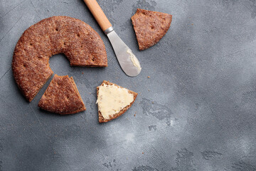 Reikäleipä - traditional finnish rye bread on a gray concrete background