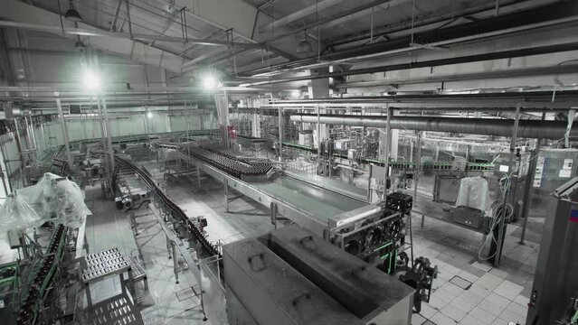 Beer factory interior with a lot of machines in work