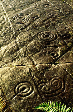 Prehistoric cup and ring mark carved stone rock art outcrop at Achnabreck, Kilmartin Valley, Argyll, west Scotland, UK