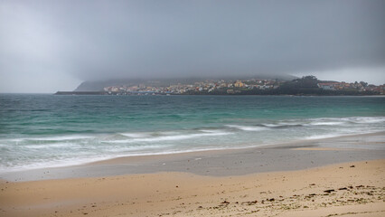 Seaside view of Fisterra: Long Exposure of a Rain Cloud over Finisterre, Galicia, from the Langosteira Beach