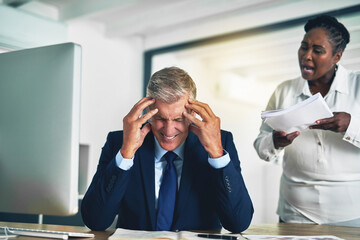 Is this your idea of a report. Shot of an angry businesswoman berating her colleague while he sits...