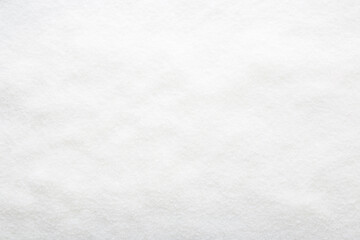 White dry sugar background. Top down view. Empty place for text.