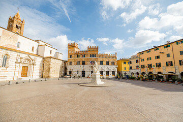 Morning view on Piazza Dante, central square in Grosseto town on sunny day. This city is the center of Maremma region at western central Italy - obrazy, fototapety, plakaty