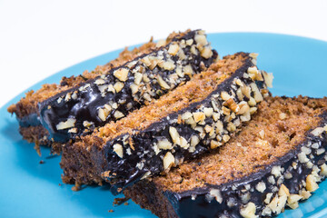 Pastry made of zucchini with nuts and raisin. Delicious dessert. White background