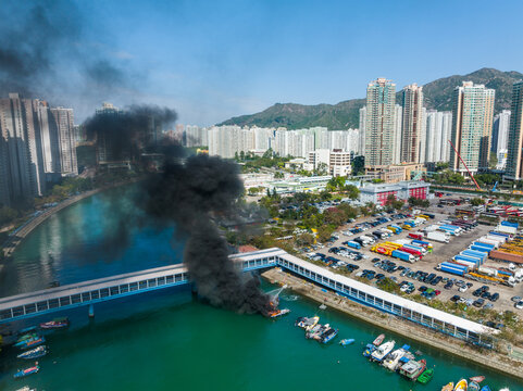 Top view of Hong Kong residential district and fire accident on boat