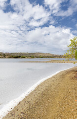 Walk along the salty shores of the Jan Thiel lagoon on the Caribbean island Curacao