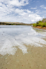 Walk along the salty shores of the Jan Thiel lagoon on the Caribbean island Curacao