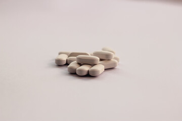 Closeup of medicine capsules on white background
