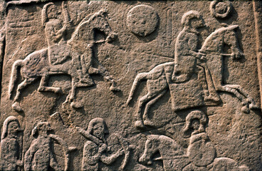 Celtic Pictish symbol stone slab detail in Aberlemno churchyard, Tayside, Scotland. Battle scene with horse cavalry and spearmen - obrazy, fototapety, plakaty