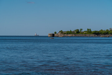 Russia. Kronstadt. May 30, 2021. The Reef Fort and Tolbukhin Lighthouse are on the horizon.