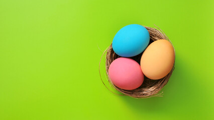 Preparation for the Easter holiday. Eggs and Easter decor on a bright background.