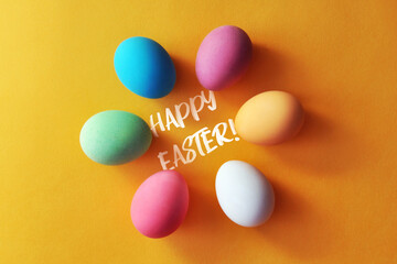 Preparation for the Easter holiday. Eggs and Easter decor on a bright background.