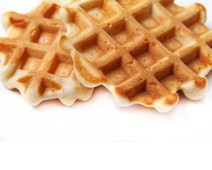 Homemade freshly baked belgian waffles isolated on white background