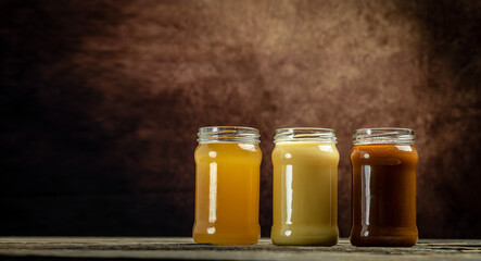 Macro photo of a bee hive on a honeycomb. Bees produce fresh, healthy, honey. Honey background. Beekeeping concept. Long banner format