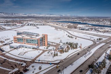 Aerial view of Highlands Ranch commercial buildings skyline in Colorado during after snow storm - Powered by Adobe