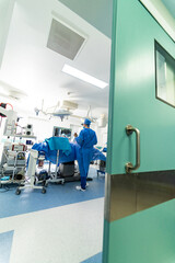 Surgical healthcare treatment. Surgeon in mask operating in emergency room.