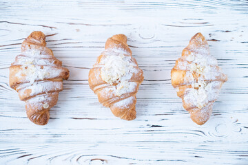 croissants on a white wooden background