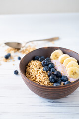 granola, yogurt, blueberries and bananas field breakfast