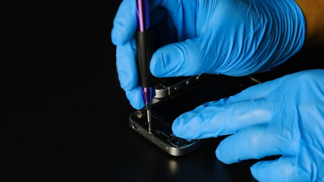 Technician repairing the Cell phone parts and tools for recovery repair phone smartphone and upgrade mobile technology,the concept of computer hardware inside.	