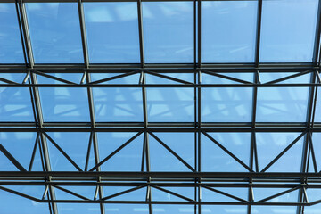 Part of a glass roof with steel structure. Modern ceiling architecture