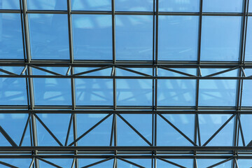 Part of a glass roof with steel structure. Modern ceiling architecture