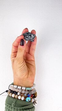 hand holding a stone turtle