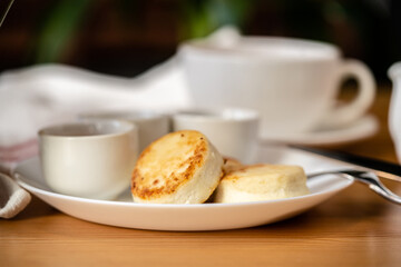 cheesecakes on a white plate with various additives