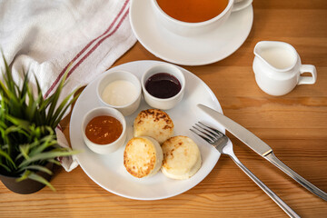 cheesecakes on a white plate with various additives