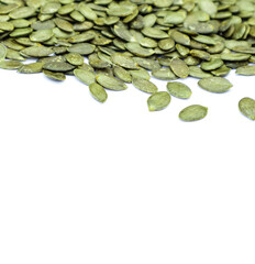 Pile of pumpkin seeds isolated on white background. Organic food, top view.