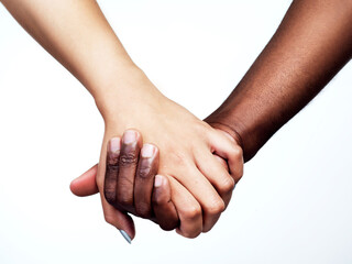 Unity is power. Studio shot of two unrecognizable people holding hands against a grey background.