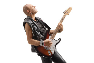 Profile shot of a rocker playing an electric guitar