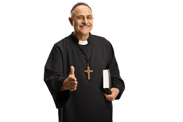 Happy priest gesturing handshake and holding a bible - obrazy, fototapety, plakaty
