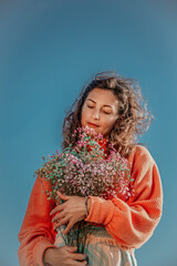 woman with dry colorful bouquet flowers 