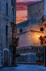 Alleyway in old  town of Bari, Puglia(Apulia), South Italy at dusk. Svevo Castle in the background.