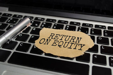 RETURN ON EQUITY text on sticker with calculator, glasses and magnifier