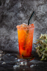 Iced tea in a plastic cup with ice