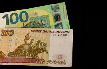 Russian rubles and euros on a black background