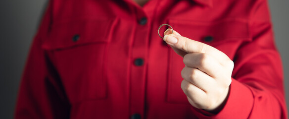 young woman holding wedding ring