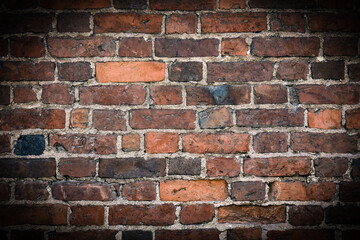 Old brick wall. Background of bricks for text , vignetted .