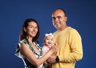 Happy family with baby daughter