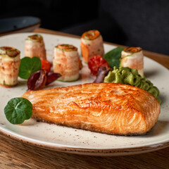 Salmon fillet with baked vegetables, dish diet. Mediterranean food with steamed fish. Oven baked. Healthy concept, gluten free, lectine free