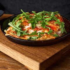 Lasagna with tomato and green leaf. Fish with bechamel sauce. The concept of healthy eating.Halal Food