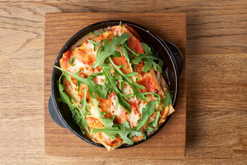 Lasagna with tomato and green leaf. Fish with bechamel sauce. The concept of healthy eating.Halal Food