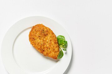 chicken cutlet on the white plate