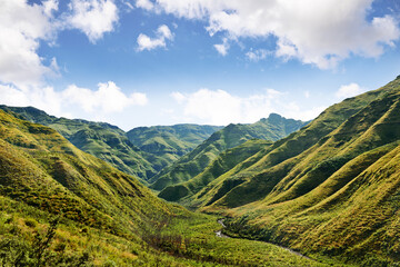 Naklejka premium Be humbled by the majestic beauty of nature.... A picturesque view over green valleys and mountains.