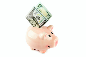 American dollars and piggy bank isolated on white .