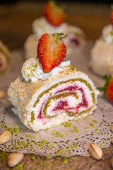 dessert pistachio roll with meringue with cream