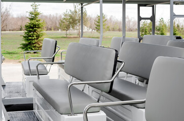 Empty open tourist bus for excursions, close-up.