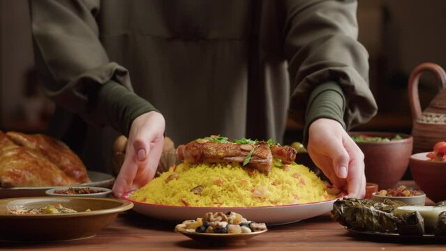 Couscous with chicken close-up, Muslim family dinner, Ramadan, iftar. Mediterranean and Arabian cuisine. Religious holiday, holy month. Worship and culture. Traditional Eastern Halal food.